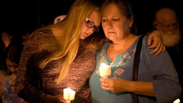 People attend a candle light vigil after a mass shooting at the First Baptist Church in Sutherland Springs, Texas on November 5, 2017. A gunman dressed in black tactical gear killed at least 26 people and wounded 20 others at a white-steepled church in Texas on Sunday, carrying out the latest in a series of mass shootings that have plagued the United States. (Sergio Flores / REUTERS) People attend a candle light vigil after a mass shooting at the First Baptist Church in Sutherland Springs, Texas on November 5, 2017. A gunman dressed in black tactical gear killed at least 26 people and wounded 20 others at a white-steepled church in Texas on Sunday, carrying out the latest in a series of mass shootings that have plagued the United States. (Sergio Flores / REUTERS)