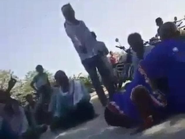 A woman panchayat member being made to lick her saliva in Muzaffarpur district of Bihar. (Video grab) A woman panchayat member being made to lick her saliva in Muzaffarpur district of Bihar. (Video grab)