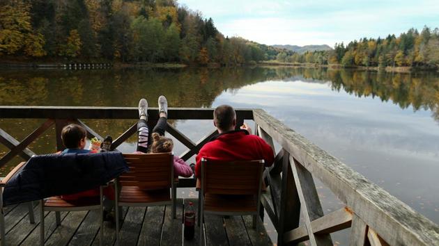During an autumn day, people relax while enjoying the view of the Lake Trakoscan in Croatia. (Antonio Bronic / REUTERS) During an autumn day, people relax while enjoying the view of the Lake Trakoscan in Croatia. (Antonio Bronic / REUTERS)