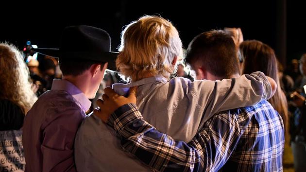 Local residents embrace during a candlelight vigil for victims of the shooting. Sutherland Springs is a small rural community of about 680 people --residents told reporters it was a place where nothing ever happened and everyone knew everyone. (Mohammad Khursheed / REUTERS) Local residents embrace during a candlelight vigil for victims of the shooting. Sutherland Springs is a small rural community of about 680 people --residents told reporters it was a place where nothing ever happened and everyone knew everyone. (Mohammad Khursheed / REUTERS)