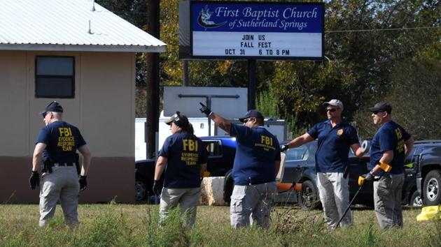 FBI agents search for clues at the entrance to the First Baptist Church, after a mass shooting that killed 26 people in Sutherland Springs, Texas on November 6, 2017. (AFP) FBI agents search for clues at the entrance to the First Baptist Church, after a mass shooting that killed 26 people in Sutherland Springs, Texas on November 6, 2017. (AFP)
