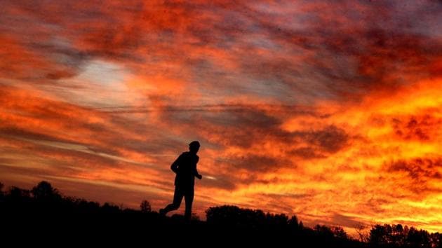 A runner takes a warm up jog in the autumn sunrise on Saturday, shortly before the start of the fourth annual Battlefield Half Marathon at the Kernstown Battlefield in Kernstown. (Jeff Taylor / AP) A runner takes a warm up jog in the autumn sunrise on Saturday, shortly before the start of the fourth annual Battlefield Half Marathon at the Kernstown Battlefield in Kernstown. (Jeff Taylor / AP)