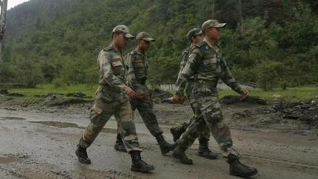 Indian army soldiers march near an army base on Tezpur-Tawang highway. (Reuters File Photo) Indian army soldiers march near an army base on Tezpur-Tawang highway. (Reuters File Photo)