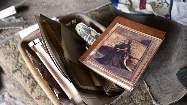 A collection of family photographs, wads of visiting cards of foreign journalists and diplomats, copies of biography written by Princess Sakina Mahal and a collection of elegies and sonnets in Urdu penned by 19th century Awadhi poet Mir Baber Ali Anees were found at the premises. (Sanchit Khanna / HT Photo) A collection of family photographs, wads of visiting cards of foreign journalists and diplomats, copies of biography written by Princess Sakina Mahal and a collection of elegies and sonnets in Urdu penned by 19th century Awadhi poet Mir Baber Ali Anees were found at the premises. (Sanchit Khanna / HT Photo)