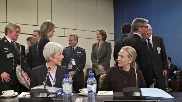 Mariot Leslie with US secretary of state Hillary Clinton at a conference at the NATO headquarters, Brussels, December 7, 2011(REUTERS)