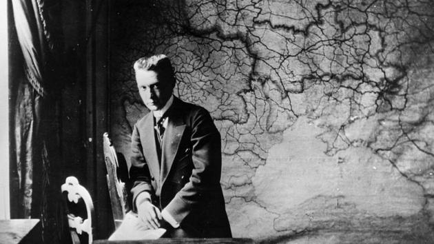 Aleksandr Fyodorovich Kerensky, leader of the Russian Provisional Government, at his desk during the Revolution. Kerensky led the government that replaced the Czar, with the intention of organizing swift elections to the Russian Constituent assembly. His government lasted a tumultuous 8 months, rife with inaction caused by a lack on enforcement ability and political factionalism. (Keystone / Getty Images)