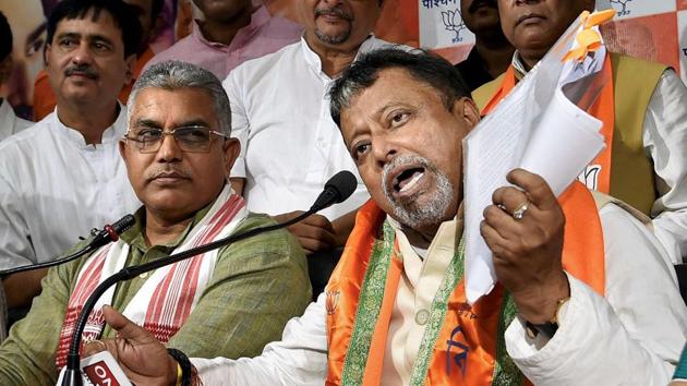 Mukul Roy addresses media during his first visit to the state BJP office after his induction into the party, in Kolkata on Monday. West Bengal BJP President Dilip Ghosh is also seen. (PTI) Mukul Roy addresses media during his first visit to the state BJP office after his induction into the party, in Kolkata on Monday. West Bengal BJP President Dilip Ghosh is also seen. (PTI)