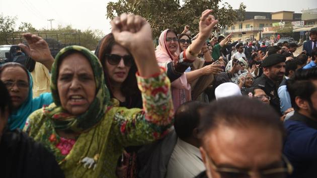Activists shout slogans as the vehicle carrying ousted Pakistani prime minister Nawaz Sharif leaves after he appeared in an accountability court in Islamabad on November 7, 2017. Sharif, the 15th premier in Pakistan's 70-year history to be ousted before completing a full term, is facing corruption charges. (AFP) Activists shout slogans as the vehicle carrying ousted Pakistani prime minister Nawaz Sharif leaves after he appeared in an accountability court in Islamabad on November 7, 2017. Sharif, the 15th premier in Pakistan's 70-year history to be ousted before completing a full term, is facing corruption charges. (AFP)