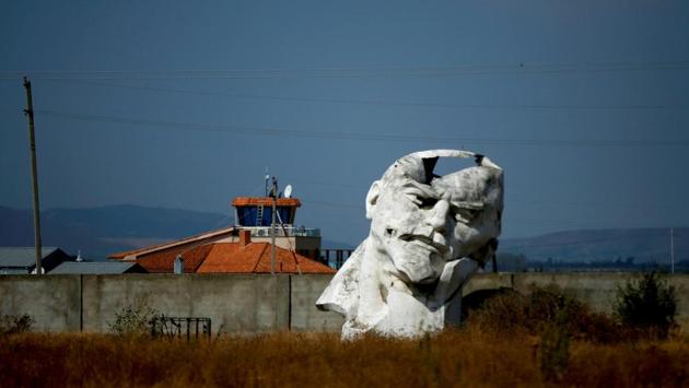 A damaged bust of Lenin lies at a private abandoned courtyard outside Tbilisi. As the first leader of the one-party communist state, Lenin redistributed land and nationalised industry and banks in a bid to champion the working class. He also used violence on a wide scale to crush perceived opponents of Marxist ideology. (David Mdzinarishvili / REUTERS)