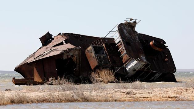 A ruined ship with Communist Party symbol hammer and sickle lies on a salinated part of the Aral Sea coast line near the village of Akespe. (Shamil Zhumatov / REUTERS)