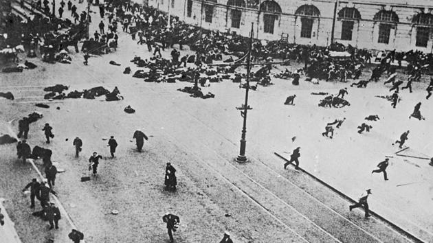 Russian troops fire on demonstrators with machine guns, on the corner of Nevsky Prospect and Sadovaya Street, in St.Petersburg on July 4, 1917. In the strife of this environment, soldiers and industrial workers of the Petrograd Soviet, a centre of opposition to the Provisional Government and backed by the Bolsheviks emerged in spontaneous demonstrations over what came to be known as the July Days. (Karl Bulla Historical Foundation via AP)