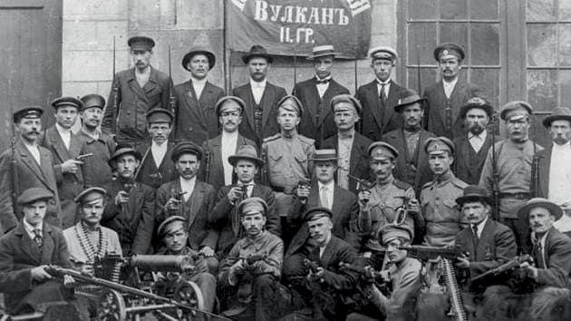 Armed workers of Vulcan plant, calling themselves the Red Guard pose for a photo in St.Petersburg. The Petrograd Bolsheviks openly created a revolutionary military committee led by Leon Trotsky, the soviet’s president. It comprised armed workers, members of the army and navy, methodically planning to occupy strategic locations through the city despite the knowledge of the Kerensky government. (Karl Bulla Historical Foundation via AP)