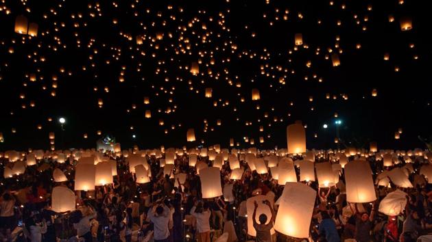 A crowd releases lanterns into air as they celebrate the Yee Peng festival, in Chiang Mai. This event in Northern Thailand pays respects to Buddha. (Reuben Easey / AFP)