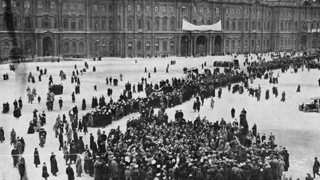 Demonstrators gather in front of the Winter Palace in Petrograd, formerly St Petersburg and later re-named Leningrad, during the Russian Revolution. Armed Bolsheviks gathered at the Winter Palace with the provisional government holed up inside. The insurrection faced little opposition as the artillery guarding the site abandoned their posts and Bolshevik forces entered the building post midnight. (Hulton Archive / Getty Images)