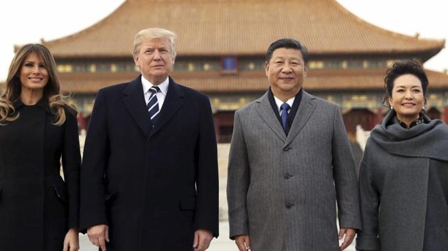 President Donald Trump, first lady Melania Trump with Chinese President Xi Jinping and his wife Peng Liyuan in Beijing on Wednesday. (AP Photo) President Donald Trump, first lady Melania Trump with Chinese President Xi Jinping and his wife Peng Liyuan in Beijing on Wednesday. (AP Photo)