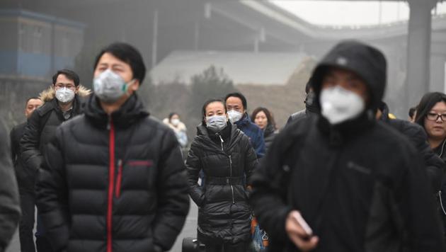 Commuters wear masks on a polluted day in Beijing. The government is looking at several ways to curb pollution in Beijing and its surrounding areas. (AFP File) Commuters wear masks on a polluted day in Beijing. The government is looking at several ways to curb pollution in Beijing and its surrounding areas. (AFP File)
