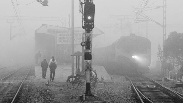 A train from Jalandhar to Pathankot emerges in the dense fog on November 07, 2017. While experts are still undecided about whether it’s fog or smog that’s engulfed most of north India, trains continued to be delayed. (Pardeep Pandit / HT Photo) A train from Jalandhar to Pathankot emerges in the dense fog on November 07, 2017. While experts are still undecided about whether it’s fog or smog that’s engulfed most of north India, trains continued to be delayed. (Pardeep Pandit / HT Photo)