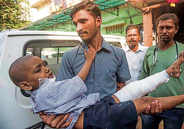 Kamal Mewati, one of the injured siblings, being carried to an ambulance in Mumbai. (Satish Bate/HT Photo) Kamal Mewati, one of the injured siblings, being carried to an ambulance in Mumbai. (Satish Bate/HT Photo)