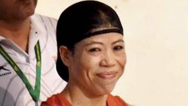 Mary Kom celebrates after winning her fifth Asian Boxing Championship gold medal in Ho Chi Minh City in Vietnam on Wednesday. (PTI) Mary Kom celebrates after winning her fifth Asian Boxing Championship gold medal in Ho Chi Minh City in Vietnam on Wednesday. (PTI)