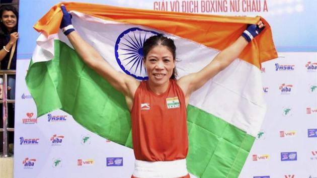 Mary Kom (C) after winning the Asian Boxing Championships gold in Ho Chi Minh City on Wednesday. The 34-year-old Manipuri boxer last won a gold medal in the 2014 Incheon Asian Games.(PTI)
