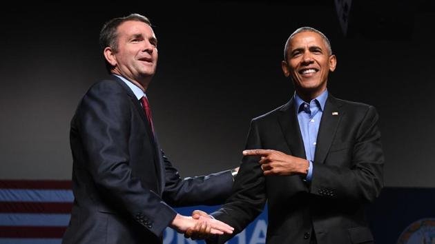 Former US President Barack Obama (right) gestures to Democratic candidate Ralph Northam during a campaign rally in Richmond, Virginia, last month. Northam, a physician and Gulf War veteran, easily defeated Ed Gillespie, an establishment Republican figure, in the state elections. (AFP File) Former US President Barack Obama (right) gestures to Democratic candidate Ralph Northam during a campaign rally in Richmond, Virginia, last month. Northam, a physician and Gulf War veteran, easily defeated Ed Gillespie, an establishment Republican figure, in the state elections. (AFP File)