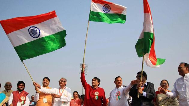 Union minister for commerce and industry Suresh Prabhu waves the tri-colour as he joins students and musicians participating in 'Voice of Unity' event at SMS Stadium in Jaipur on Wednesday. (PTI) Union minister for commerce and industry Suresh Prabhu waves the tri-colour as he joins students and musicians participating in 'Voice of Unity' event at SMS Stadium in Jaipur on Wednesday. (PTI)