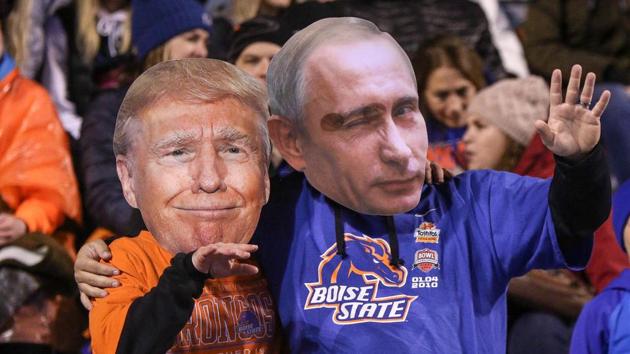A couple of Boise State Broncos fans wear Donald Trump and Vladimir Putin masks during second half action between the Wyoming Cowboys and the Boise State Broncos, October 21, 2017, Albertsons Stadium in Boise, Idaho (AFP) A couple of Boise State Broncos fans wear Donald Trump and Vladimir Putin masks during second half action between the Wyoming Cowboys and the Boise State Broncos, October 21, 2017, Albertsons Stadium in Boise, Idaho (AFP)