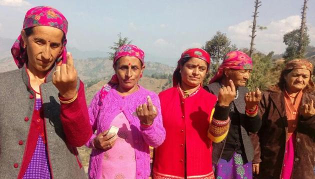 Women after casting their vote in Fagu near Theog in Shimla district on Thursday. (HT Photo)