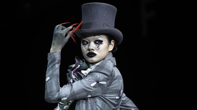 An interpretation of the ‘Mad Hatter’ from ‘Alice in Wonderland,’ a model walks for Hu Sheguang at China Fashion Week. (Wang Zhao / AFP) An interpretation of the ‘Mad Hatter’ from ‘Alice in Wonderland,’ a model walks for Hu Sheguang at China Fashion Week. (Wang Zhao / AFP)