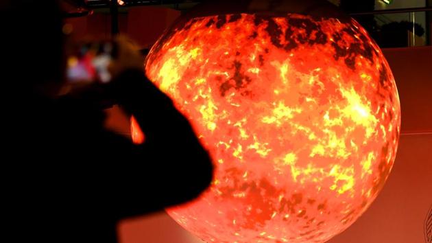 A visitor takes pictures of a sphere displayed at the pavillion of India on November 8 during the COP23 United Nations Climate Change Conference in Bonn, Germany. (AFP Photo) A visitor takes pictures of a sphere displayed at the pavillion of India on November 8 during the COP23 United Nations Climate Change Conference in Bonn, Germany. (AFP Photo)