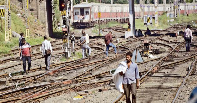 People illegally crossing railway tracks at Pune railway station on November 7. Though accidents due to trespassing have come down in recent years, a lot of people still prefer this illegal ‘shortcut’. (Ravindra Joshi/HT PHOTO) People illegally crossing railway tracks at Pune railway station on November 7. Though accidents due to trespassing have come down in recent years, a lot of people still prefer this illegal ‘shortcut’. (Ravindra Joshi/HT PHOTO)