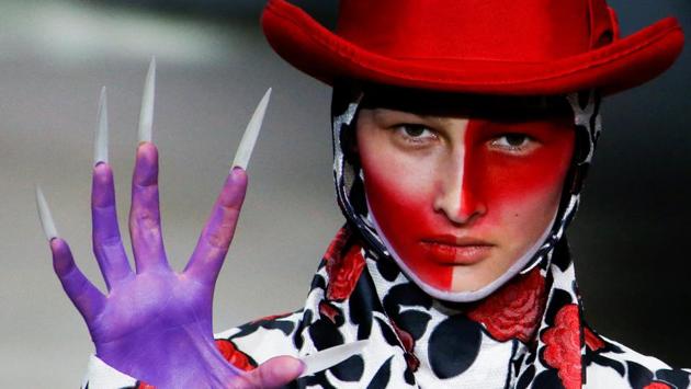Hu Sheguang’s whimsical collection didn’t stop at the accessorizing either, as different character facets from ‘Alice in Wonderland’ were interpreted in each of his designs. (Thomas Peter / REUTERS) Hu Sheguang’s whimsical collection didn’t stop at the accessorizing either, as different character facets from ‘Alice in Wonderland’ were interpreted in each of his designs. (Thomas Peter / REUTERS)