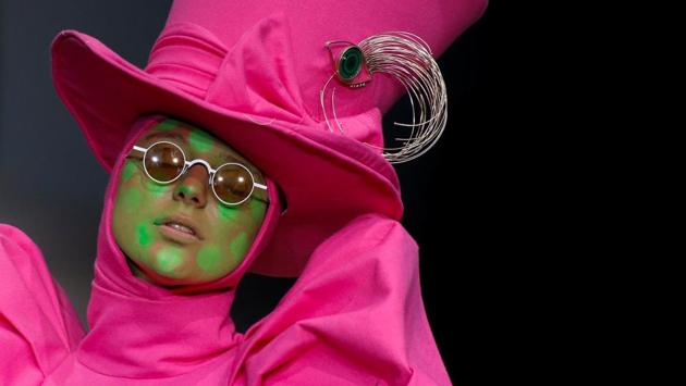 A model presents a creation by Hu Sheguang at the China Fashion Week in Beijing. His designs were inspired by Lewis Carroll’s book ‘Alice in Wonderland.’ (Thomas Peter / Reuters) A model presents a creation by Hu Sheguang at the China Fashion Week in Beijing. His designs were inspired by Lewis Carroll’s book ‘Alice in Wonderland.’ (Thomas Peter / Reuters)