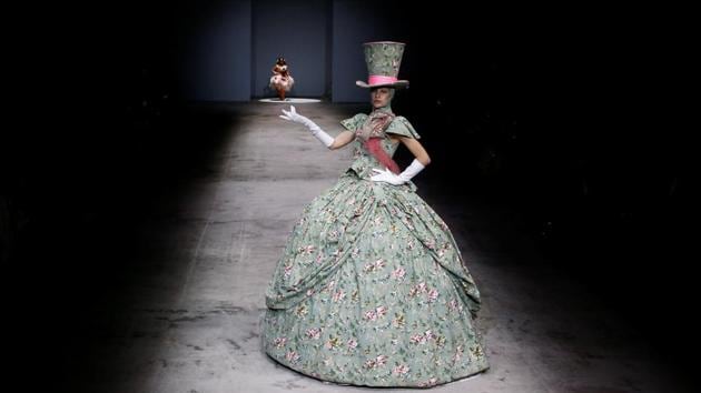 Apart from the over-the-top presentation, Hu Sheguang also presented elaborate gowns. (Thomas Peter / Reuters) Apart from the over-the-top presentation, Hu Sheguang also presented elaborate gowns. (Thomas Peter / Reuters)