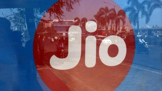 Commuters are reflected on an advertisement of Reliance Industries' Jio telecoms unit, at a bus stop in Mumbai. (Reuters File) Commuters are reflected on an advertisement of Reliance Industries' Jio telecoms unit, at a bus stop in Mumbai. (Reuters File)
