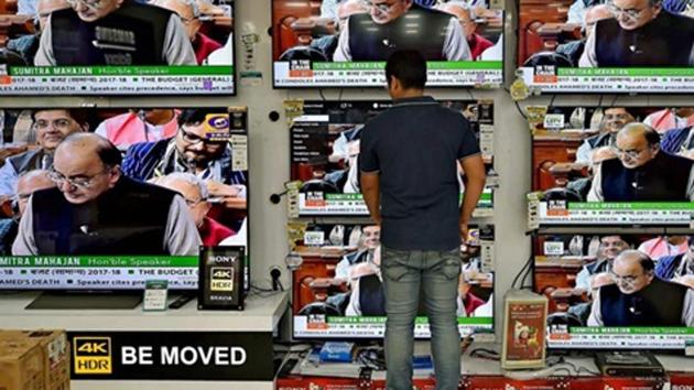 A man watches the Union Budget 2017-18 presentation by finance minister Arun Jaitley on TV at a showroom in Kolkata in February 2017. (PTI File Photo) A man watches the Union Budget 2017-18 presentation by finance minister Arun Jaitley on TV at a showroom in Kolkata in February 2017. (PTI File Photo)