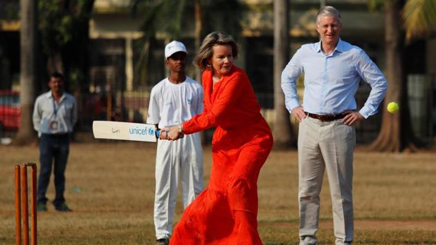 Belgium's King Philippe looks on as Queen Mathilde hits a ball as they play cricket with children in Mumbai on November 10, 2017. (Danish Siddiqui / REUTERS)