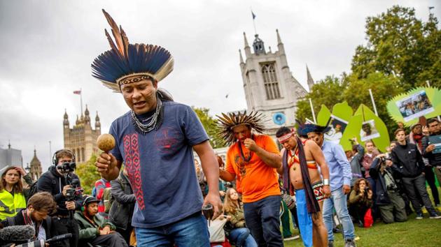 Members of a delegation of indigenous and rural community leaders from 14 countries in Latin America and Indonesia, the Guardians of the Forest campaign, demonstrate against deforestation in London during a stop on their way to the United Nations Framework Convention on Climate Change (UNFCCC) Conference of the Parties 23 (COP 23) in Bonn, Germany.  (Tolga Akmen / AFP) 