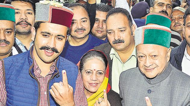 Chief minister Virbhadra Singh with her wife Pratibha Singh and son and Congress candidate from Shimla rural Vikramaditya Singh after casting their vote at Rampur in Shimla district on Thursday. (HT Photo) Chief minister Virbhadra Singh with her wife Pratibha Singh and son and Congress candidate from Shimla rural Vikramaditya Singh after casting their vote at Rampur in Shimla district on Thursday. (HT Photo)