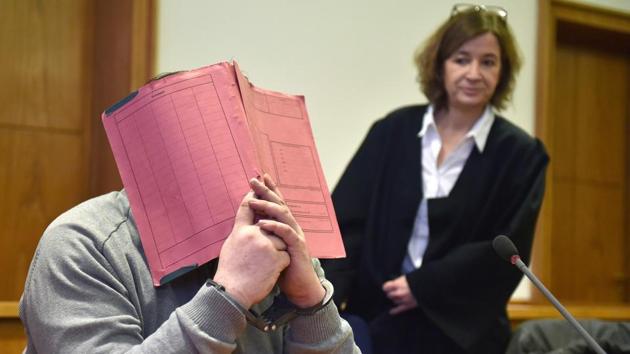 German former male nurse Niels Hoegel hiding his face behind a folder as he waits next to his lawyer Ulrike Baumann (R) for the opening of another session of his trial at court in Oldenburg, northwestern Germany on February 26, 2015. (AFP File Photo) German former male nurse Niels Hoegel hiding his face behind a folder as he waits next to his lawyer Ulrike Baumann (R) for the opening of another session of his trial at court in Oldenburg, northwestern Germany on February 26, 2015. (AFP File Photo)