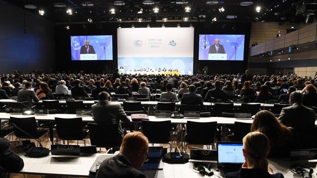 Frank Bainimarama, Prime Minister of Fiji delivers his speech during the opening session of the COP23. He said there was a need to keep the climate action commitments in full and not back away from them.  Adding, “That is why Fiji has been so determined to help build a grand coalition of governments at every level and to connect this effort to as many of the 7.5 billion citizens of the planet as possible.” (Patrik Stollarz / AFP) 