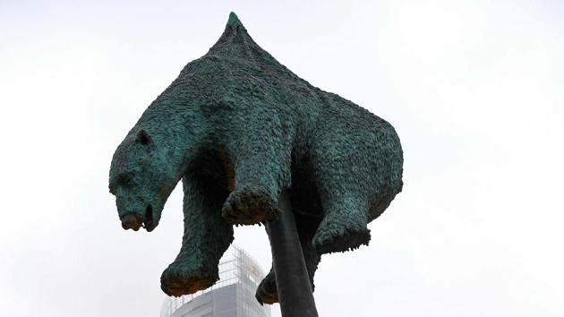 The bronze sculpture “Unbearable” by Danish artist Jens Galschiot featuring a polar bear impaled on an oil pipeline is on display at Rheinaue Park during the COP23 United Nations Climate Change Conference in Bonn, Germany. (Patrik Stollarz / AFP) 