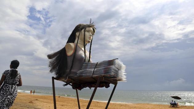 A mannequin stands on a makeshift stall put up by a vendor selling hair decorating items for women at the Shangumugham beach on the Arabian Sea coast in Thiruvananthapuram on November 8, 2017. (Aijaz Rahi / AP)