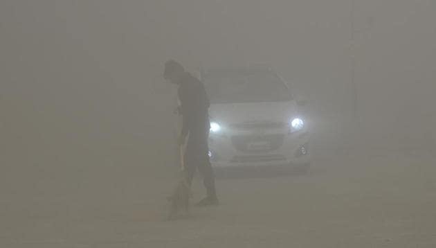 A worker uses a broom to sweep away dust in the morning fog in Greater Noida, near New Delhi, India, Friday, Nov.10, 2017. (AP) A worker uses a broom to sweep away dust in the morning fog in Greater Noida, near New Delhi, India, Friday, Nov.10, 2017. (AP)