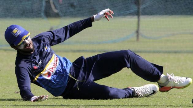 Dinesh Chandimal,left, dives to catch a ball during their practice. (AP) Dinesh Chandimal,left, dives to catch a ball during their practice. (AP)