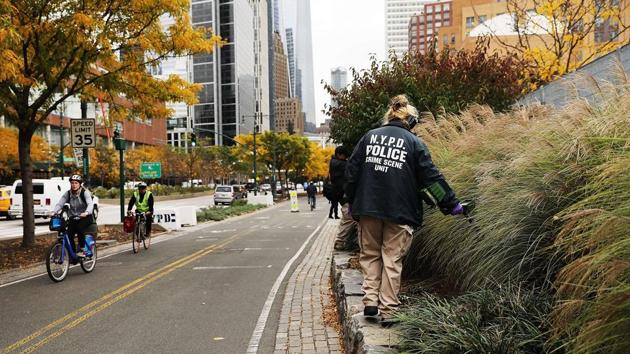 A member of the police department's crime scene unit searches the location where terrorist Sayfullo Saipov drove down a Manhattan bike path and went on a rampage with a truck in New York City. Eight people were killed and 12 were injured when 29-year-old Saipov intentionally drove a truck onto a bike path(AFP) A member of the police department's crime scene unit searches the location where terrorist Sayfullo Saipov drove down a Manhattan bike path and went on a rampage with a truck in New York City. Eight people were killed and 12 were injured when 29-year-old Saipov intentionally drove a truck onto a bike path(AFP)