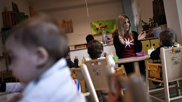 An educator plays with children in the nursery of Bollate Penitentiary. Simona Gallo, a prison educator feels, “It’s important that the children of prisoners, who have not committed any crime, can spend time in a ‘normal’ environment. That is also the sense of my work, the aim of prison after all is rehabilitation.” (Marco Bertorello / AFP) An educator plays with children in the nursery of Bollate Penitentiary. Simona Gallo, a prison educator feels, “It’s important that the children of prisoners, who have not committed any crime, can spend time in a ‘normal’ environment. That is also the sense of my work, the aim of prison after all is rehabilitation.” (Marco Bertorello / AFP)