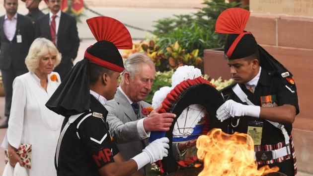 Prince Charles and his wife Camilla pay homage at Amar Jawan Jyoti, India Gate in New Delhi on Thursday. (Mohd Zakir / HT PHOTO)