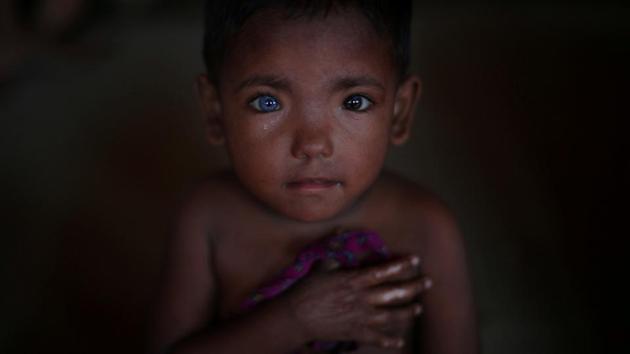 Hosne Ara, aged 4, a Rohingya refugee who fled Myanmar two-months ago listens to children singing at a children's centre in the Kutupalong refugee camp near Cox's Bazar, Bangladesh on November 5, 2017. (Hannah McKay / REUTERS) Hosne Ara, aged 4, a Rohingya refugee who fled Myanmar two-months ago listens to children singing at a children's centre in the Kutupalong refugee camp near Cox's Bazar, Bangladesh on November 5, 2017. (Hannah McKay / REUTERS)