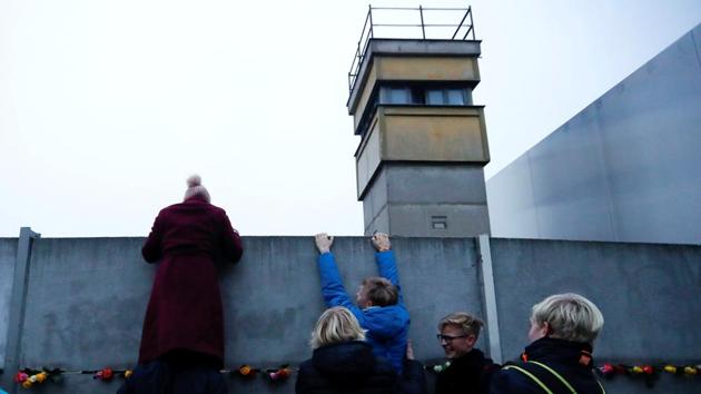 Students climb the Berlin Wall memorial in Bernauer Strasse, as Germany marks the 28th anniversary of the fall of the wall in Berlin, Germany on November 9, 2017. (Fabrizio Bensch / REUTERS) Students climb the Berlin Wall memorial in Bernauer Strasse, as Germany marks the 28th anniversary of the fall of the wall in Berlin, Germany on November 9, 2017. (Fabrizio Bensch / REUTERS)